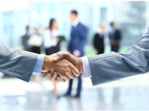 Shaking hands to signify a successful security services deal