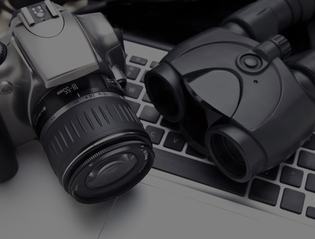 Camera, binoculars, and computer used for surveillance during investigations